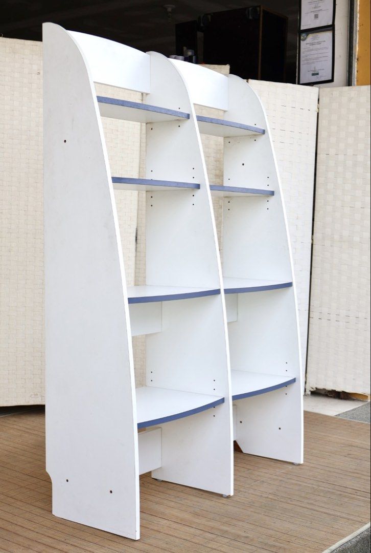 White and Blue 2-Tier Bookshelf Display Shelf (Category: Shelves, Cabinets & Racks) located in Bulacan. Submitted by FurnitureGallery (Listing ID 1463996604, Image 2). Description: - White bookshelf with stylish blue shelf accents - Two separate units, can be placed together or separately - Each unit features four spacious shelves - Perfect for organizing books, displaying decor, and more - Dimensions: Approx. [insert height] tall x [insert width