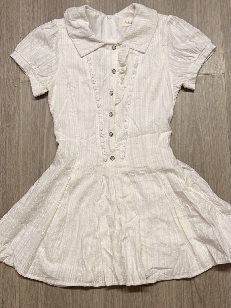 White eyelet mini dress (Category: Dresses) located in Meycauayan. Submitted by threadvibes.co (Listing ID 1464030376, Image 1). Description: Size on tag: Xs Brand: A.L.N Message me for inquiries✨ Strictly payment first Location - Bulacan MOP - Gcash Courier - Regular J&T Express.