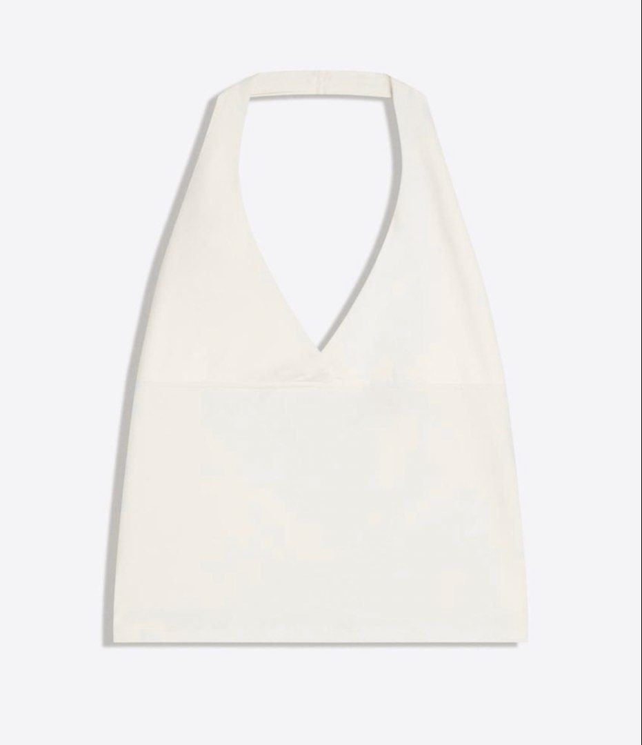 White Halter Top (Category: Others Tops) located in Manila. Submitted by chicdistrict.ph (Listing ID 1463976853, Image 2). Description: - White halter top with V-neck and adjustable neck tie - Matching simple canvas tote bag with single strap - Ideal for a casual, beachy, or everyday look - Both items are in good, pre-loved condition.