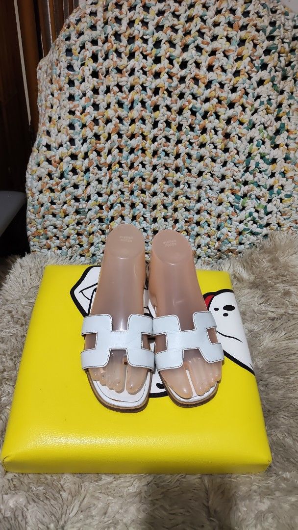 White Hermes Style Sandals (Category: Flats & Sandals) located in Cebu City. Submitted by lumaynojes00490 (Listing ID 1463958291, Image 3). Description: - White slide sandals - Features iconic H detail - Super comfy for everyday wear - Easy to slip on and off - Ideal for casual outings and errands - Classic, versatile style.