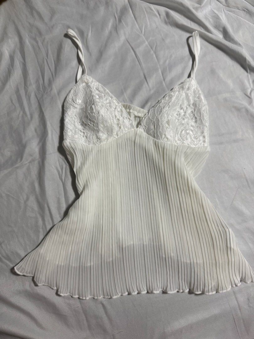 White Lace Pleated Cami Top (Category: Sleeveless) located in Manila. Submitted by glossywife (Listing ID 1464084678, Image 1). Description: Only tried it on but never really used it Perf as a night out top! Size S Bought in Vietnam Mop: GCash / Bank Transfer Mod: GrabExpress / J&T / Lalamove Brandy Melville Zara Isa the label H&M Cotton On Stradivarius Phia Hollister Subdued John Galt Miu the label Traje Linen Bershka Aritzia Princess Polly Free