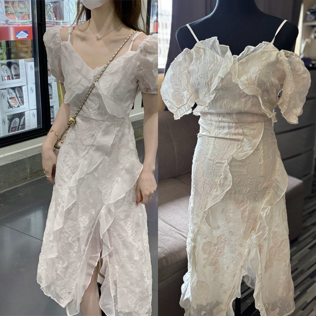 White Lace Ruffle Cold Shoulder Midi Dress WITH SLIGHT ISSUE (Category: Dresses) located in Caloocan City. Submitted by niki.niki. (Listing ID 1463998087, Image 1). Description: - Elegant white midi dress - Delicate lace overlay and ruffle details - Flattering cold shoulder design with puff sleeves - Chic V-neckline - Stylish slit in the skirt - Ideal for special occasions or romantic dinners - Feminine and chic aesthetic.