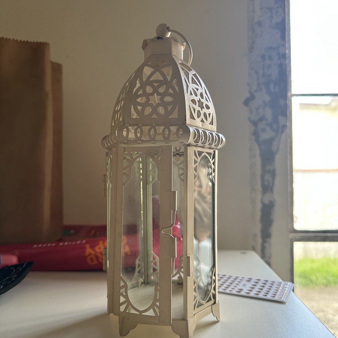White Metal Decorative Lantern with Glass Panels (Category: Lighting) located in Kawit. Submitted by wevibevintage (Listing ID 1463980502, Image 1). Description: Glass 10inches.