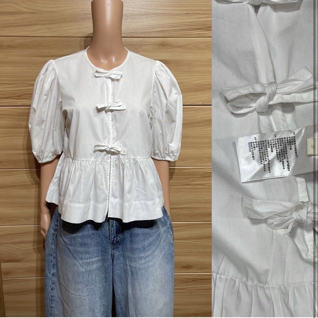 White Puff Sleeve Peplum Blouse with Bows (Category: Blouses) located in Tuguegarao City. Submitted by closet_jz (Listing ID 1464131033, Image 1). Description: - Cute white peplum blouse - Features puff sleeves - Three decorative bows down the front - Ruffled hem - Made of a crisp cotton blend - Ideal for a feminine look.