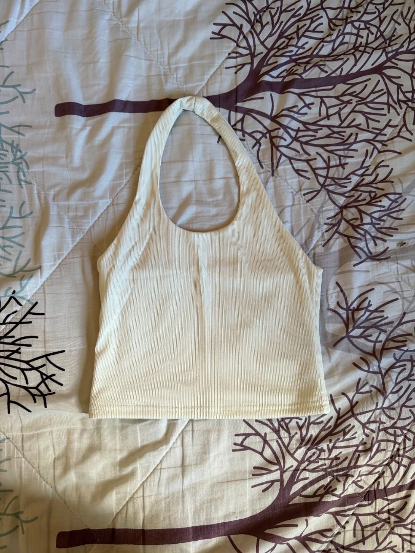 White Ribbed Halter Neck Crop Top (Category: Sleeveless) located in Manila. Submitted by dndclothing (Listing ID 1463979161, Image 1). Description: ⊹ white ribbed halter neck crop top ⊹ free size but best fits S-M ⊹ stretchy material for a comfortable fit ⊹ super versatile: dress up or down perfect for summer days or nights out.