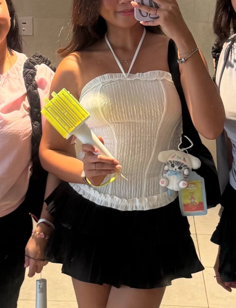 White Ruffled Tube Top with Tie Neck (Category: Sleeveless) located in Manila. Submitted by dndclothing (Listing ID 1463962296, Image 3). Description: ⊹ textured fabric, flattering corset-inspired fit ⊹ no brand, bought in vietnam ⊹ free size but im usually m for reference (28 in waist, 164 cm) ⊹ can be worn w tie neck detail/tube ⊹ perfect for concerts, casual outings, or styling.