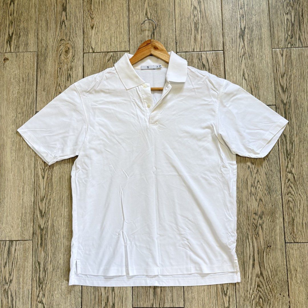 White Short Sleeve Polo Shirt (Category: Tshirts & Polo Shirts ) located in Imus. Submitted by reloved.nd (Listing ID 1464074344, Image 1). Description: - Classic white Uniqlo U polo shirt - Short sleeves - Comfortable fit - Simple button placket - Versatile for casual wear or layering - Wardrobe staple, easy to style with anything.