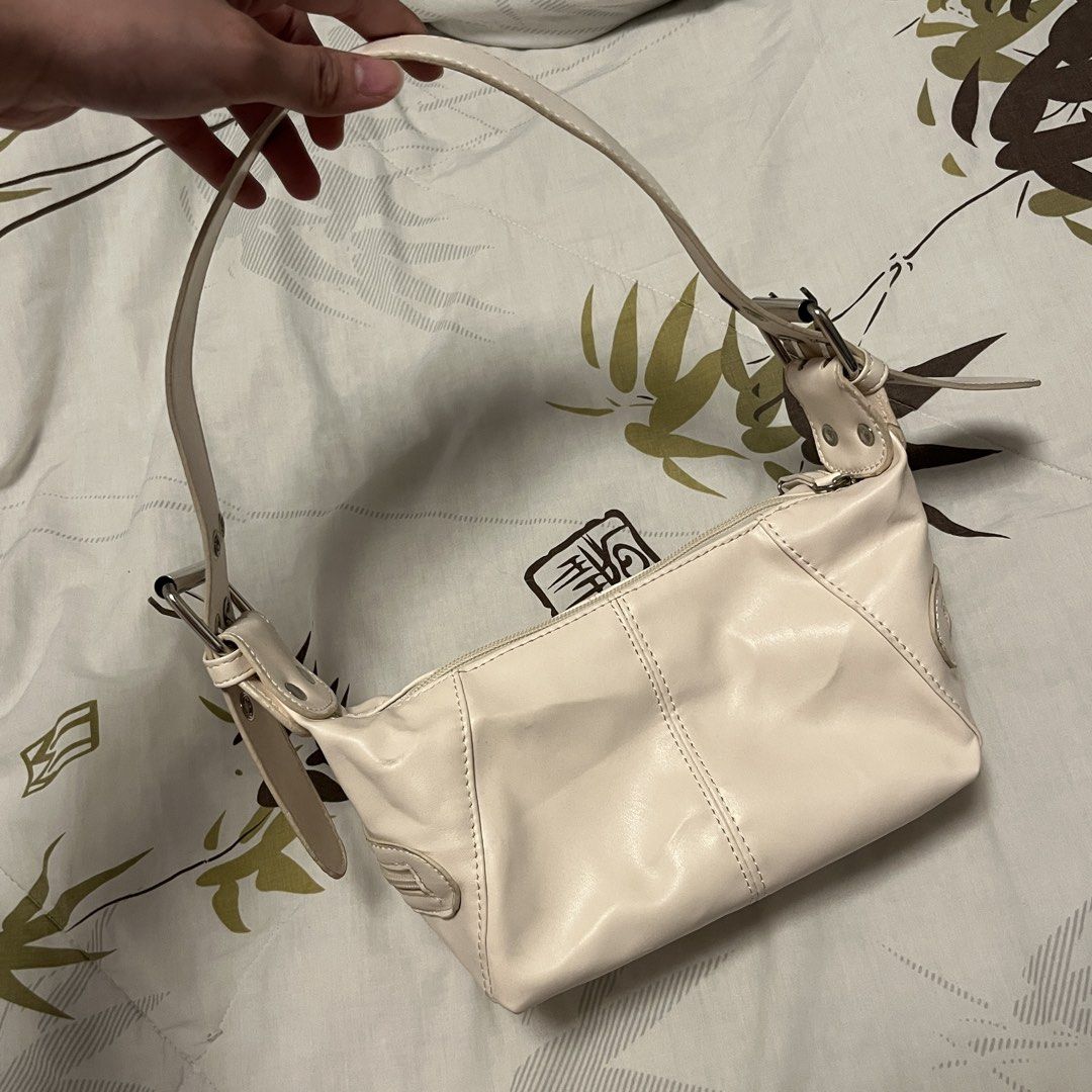 White shoulder bag with silver hardware (Category: Shoulder Bags) located in Las Pinas. Submitted by thevallerys (Listing ID 1464044142, Image 2). Description: - Cute white shoulder bag - Zip closure with front zip pocket - Adjustable strap with buckle - Used once but has minor exterior marks (check slide 5 onwards) Price negotiable .