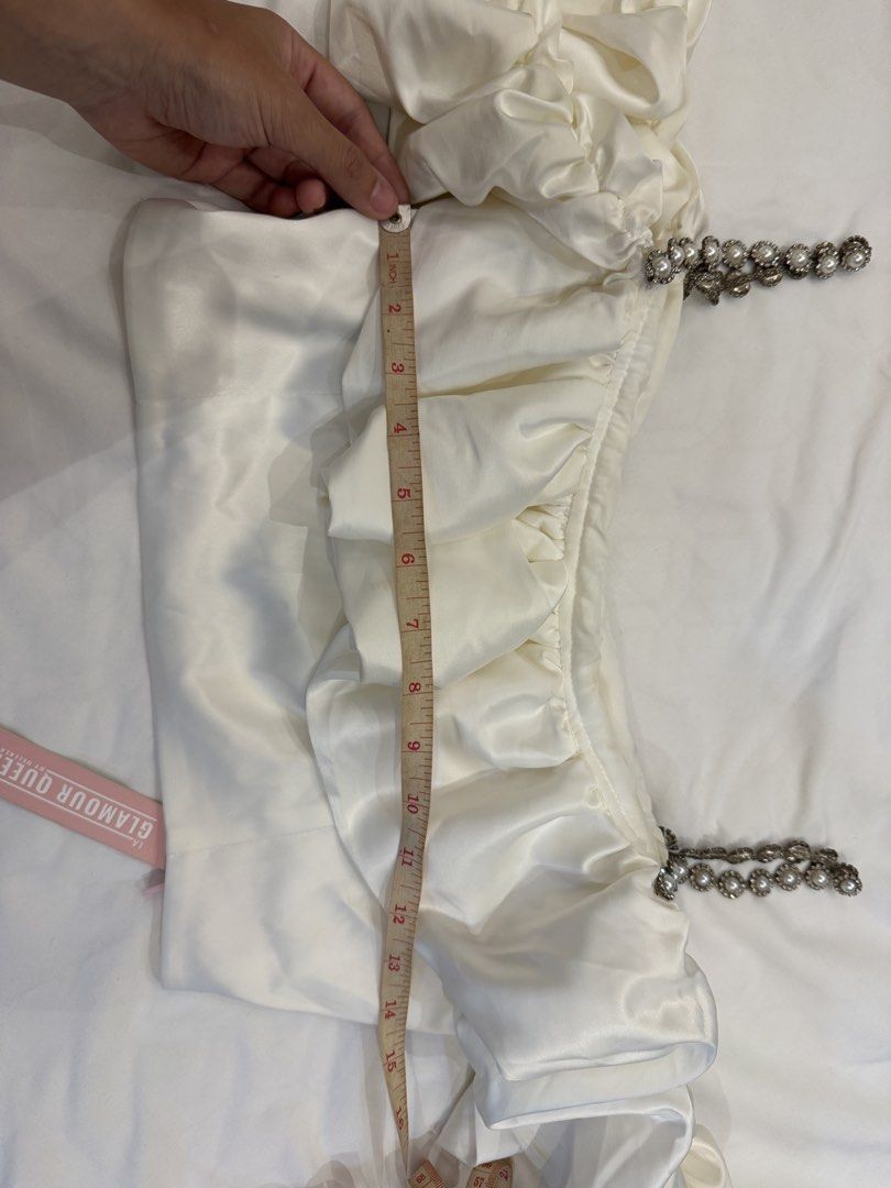White Silk Pearl Straps with Off-Shoulder Ruffle Set (Category: Sleeveless) located in Quezon City. Submitted by declutteringmycloset__ (Listing ID 1463950595, Image 2). Description: - White off-shoulder crop top - Ruffled bust detail - High waisted matching skirt - Elegant pearl strap accents - Ideal for night outs or special occasions.