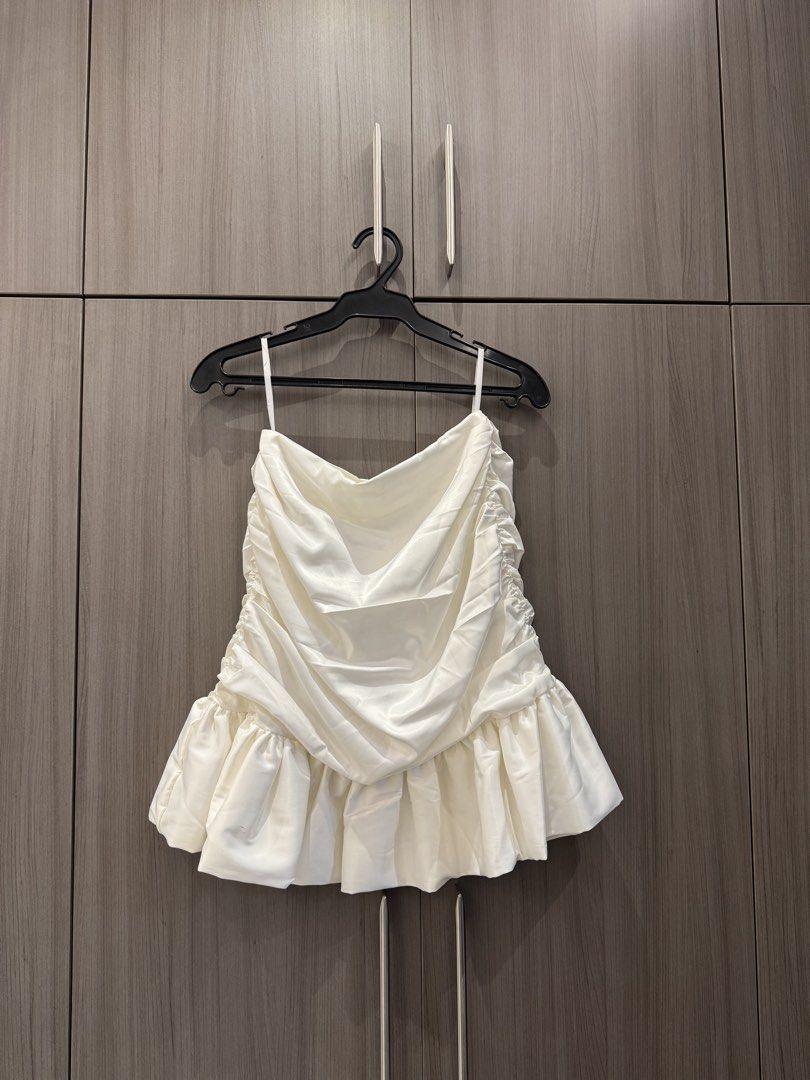 White Silk Pearl Straps with Off-Shoulder Ruffle Set (Category: Sleeveless) located in Quezon City. Submitted by declutteringmycloset__ (Listing ID 1463950595, Image 3). Description: - White off-shoulder crop top - Ruffled bust detail - High waisted matching skirt - Elegant pearl strap accents - Ideal for night outs or special occasions.