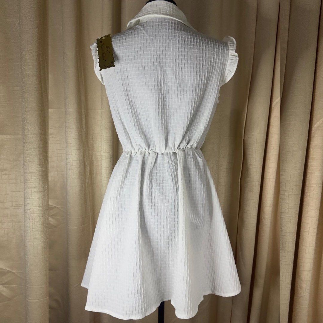 White Sleeveless Collared Button-Up Dress (Category: Dresses) located in Cainta. Submitted by vestito_bestida (Listing ID 1464021841, Image 2). Description: ⛔️ACTUAL PHOTO POSTED⛔️ 👉 Brandnew 👉 Size: small to large (free size) 👉 Length: 32" 👉 Fits size L (bust up to 38 inches) 👉 waffle 👉 White textured dress 👉 Sleeveless with ruffled cap sleeves 👉 Collared neckline with button-up front 👉 Elasticated waist for a comfortable fit 👉 Casual 