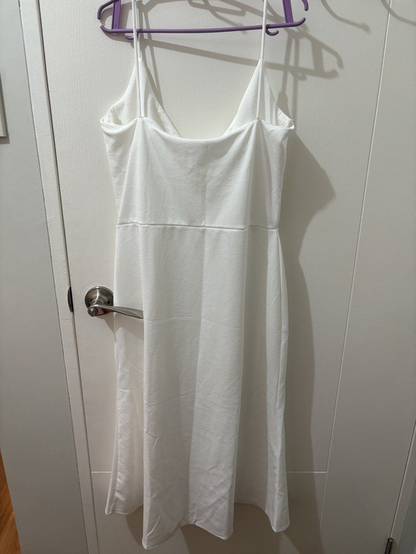 White Spaghetti Strap Midi Dress with Tie Front (Category: Dresses) located in Pasay City. Submitted by polly.unpockets (Listing ID 1464050775, Image 2). Description: - Elegant white midi dress - Delicate spaghetti straps - Flattering tie detail at the bust - Fitted waist with a flowy skirt - Versatile for events or a night out - Effortlessly chic and easy to style.