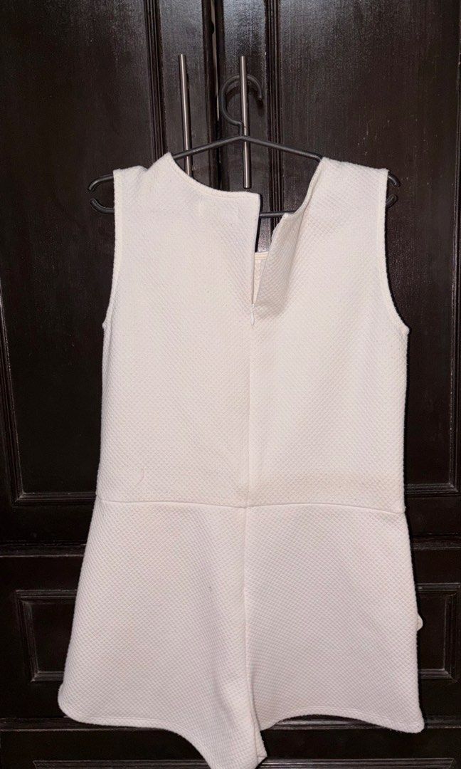 White Textured Sleeveless Playsuit (Category: Rompers) located in Manila. Submitted by keenfox-84bb (Listing ID 1464025054, Image 2). Description: - White textured playsuit - Sleeveless with round neckline - Convenient front pockets - Secure back zipper closure - Versatile for casual or dressed-up looks Fits to Small to Medium.