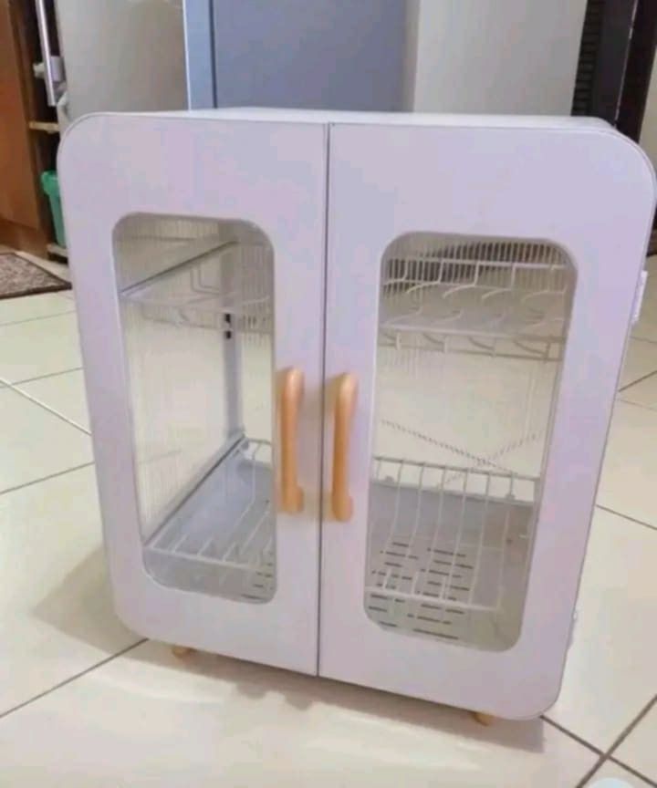WHITE TWO-DOOR STORAGE CABINET WITH TRANSPARENT DOORS (Category: Other Home Furniture) located in Manila. Submitted by vannie30 (Listing ID 1463946703, Image 1). Description: (bukas dating) black and white white two-door storage cabinet with TRANSPARENT door COD TRU LALAMOVE.