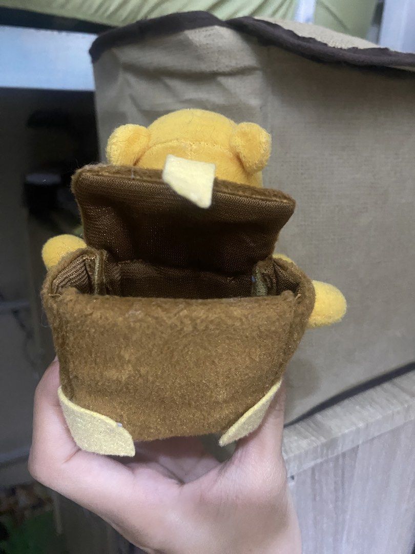 Winnie the Pooh Plush Toy with Backpack Pouch (Category: Plushies & Soft Toys) located in Manila. Submitted by faerikhae (Listing ID 1464090618, Image 2). Description: - Adorable Winnie the Pooh plush toy - Approximately 6 inches tall - Features a cute red shirt - Includes a brown backpack that opens as a small pouch - Soft, cuddly, and perfect for collecting - Makes a great small gift.