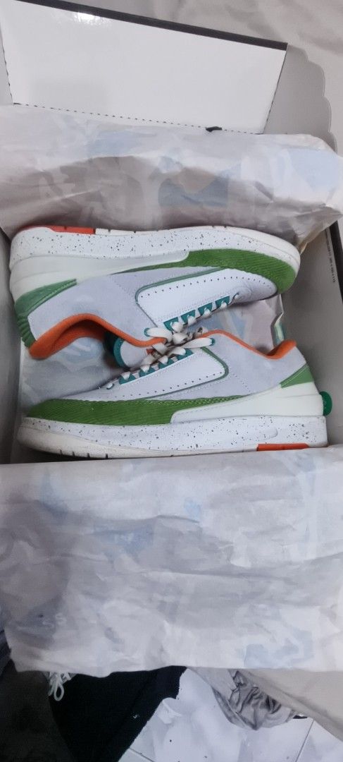 WMNS Air Jordan 2 Titan low (Category: Sneakers) located in Anda. Submitted by Pollit0_77 (Listing ID 1464073084, Image 1). Description: - Authentic WMNS Air Jordan 2 Retro Low SP - Colorway: White with green and orange accents - Size: 9 US Women's 7.5 Men's - Includes original box.