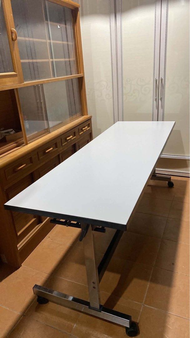 WORKING TABLE ‼️ (Category: Announcements) located in Manila. Submitted by nanzkie_2015 (Listing ID 1463981748, Image 3). Description: WORKING TABLE ‼️ L71 W23.5 H27.5 inches 🏷️5,000 *folding *stainless legs *w/ wheels.