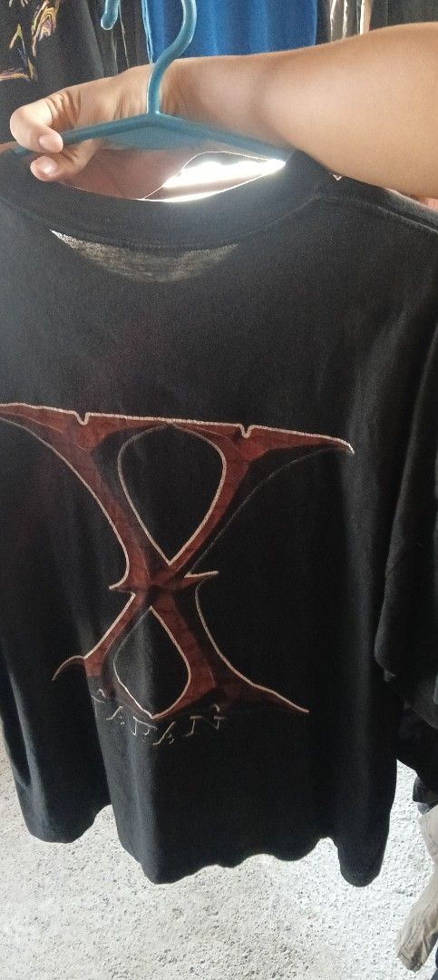 X Japan Hide T-shirt XL (Category: Tshirts & Polo Shirts ) located in Manila. Submitted by silentstone.4b0628 (Listing ID 1463967348, Image 2). Description: - Black t-shirt - Size XL - Front graphic print of Hide from X Japan - Large 'X' logo on the back - Ideal for X Japan fans.