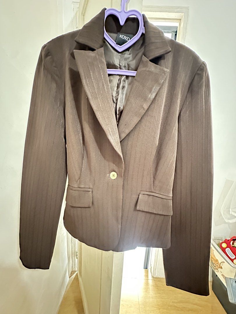 XOXO Brown Pinstripe Single Button Blazer (Category: Coats, Jackets and Outerwear) located in General Trias. Submitted by keiperry_ (Listing ID 1463947062, Image 1). Description: - Classic brown blazer with subtle pinstripe detail. - Single button front closure for a clean look. - Two functional flap pockets on the front. - Button details on the cuffs add a touch of sophistication. - Versatile piece, ideal for both professional settings and smart