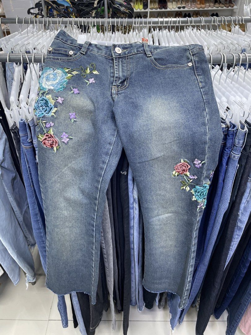 Y2k pants (Category: Jeans) located in Lucena. Submitted by riyizthriftz (Listing ID 1464126149, Image 1). Description: - Blue denim jeans - Unique floral embroidery on front and back - Trendy frayed hem detail - Classic five-pocket styling - Secure button and zip fly closure - Ideal for stylish casual wear.