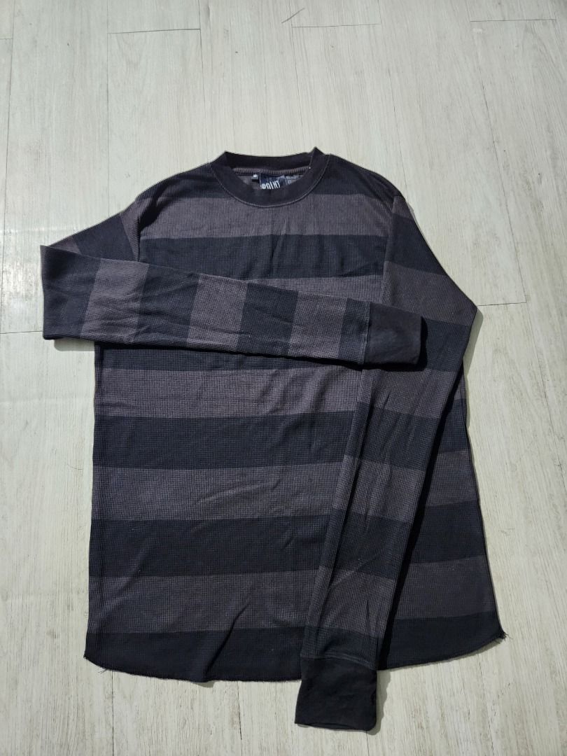 Y2k Striped Long Sleeve Shirt (Category: Tshirts & Polo Shirts ) located in Caloocan City. Submitted by asianslovesn123 (Listing ID 1464058111, Image 2). Description: - Dark grey and black striped long-sleeved shirt - Textured waffle knit fabric - Classic crew neck - Comfortable for everyday wear - Ideal for layering or wearing solo.