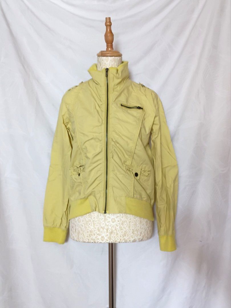 Y2k Yellow Bomber Jacket with Zip Pockets (Category: Coats, Jackets and Outerwear) located in Taguig. Submitted by butterflypea.thrift (Listing ID 1462633251, Image 1). Description: yellow bomber jacket flaw : missing zipper pull (see last pic) size: ♡ bust - 18 ♡ length - 20 (laid flat inches measurement) ꧁⎝ 𓆩༺✧༻𓆪 ⎠꧂ - color may vary due to lighting.