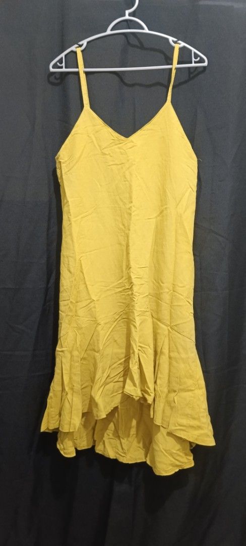 Yellow Ruffle Hem Spaghetti Strap Dress (Category: Dresses) located in Manila. Submitted by limon3s (Listing ID 1463997126, Image 1). Description: - Cute yellow dress - Spaghetti straps - V-neckline - Tiered ruffle hem - Light and flowy fabric - Ideal for casual days or beach trips - Versatile styling with sandals or sneakers.