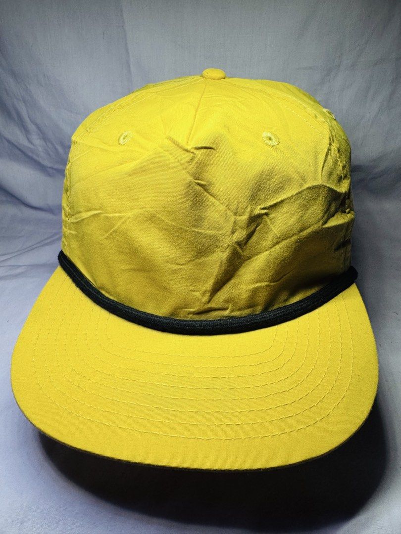 Yellow Snapback Cap with Black Rope Detail (Category: Caps & Hats) located in Roxas City. Submitted by patsquarephantz (Listing ID 1463991808, Image 2). Description: - Classic yellow snapback cap - Features a stylish black rope detail across the brim - Adjustable strap at the back for a comfortable, customized fit - Ideal for sunny weather and everyday casual wear - Versatile design that easily pairs with various outfits.