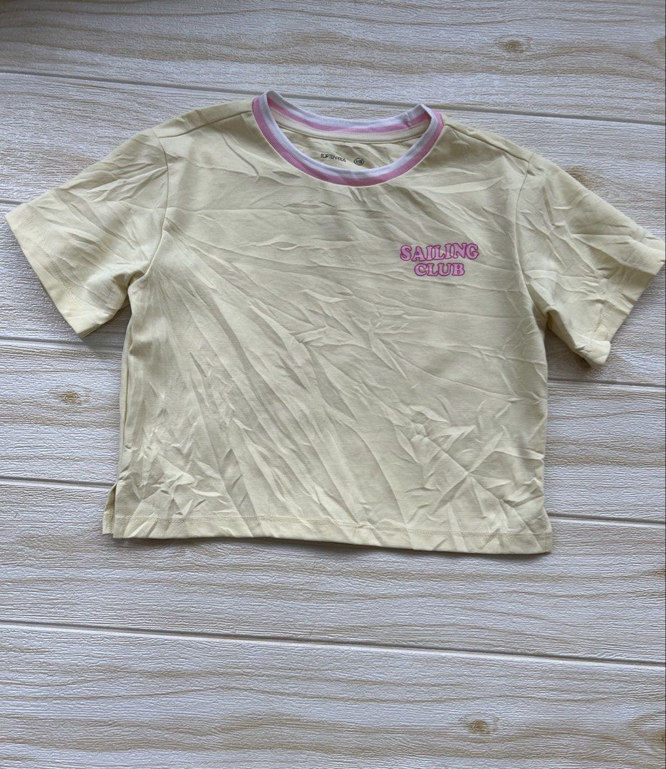 yellow Topten Kids tshirt (Category: Babies & Kids Fashion) located in Cebu City. Submitted by yjainani (Listing ID 1464033903, Image 1). Description: light yellow Topten Kids short-sleeved t-shirt featuring a pink "Sailing Club" graphic on the chest..