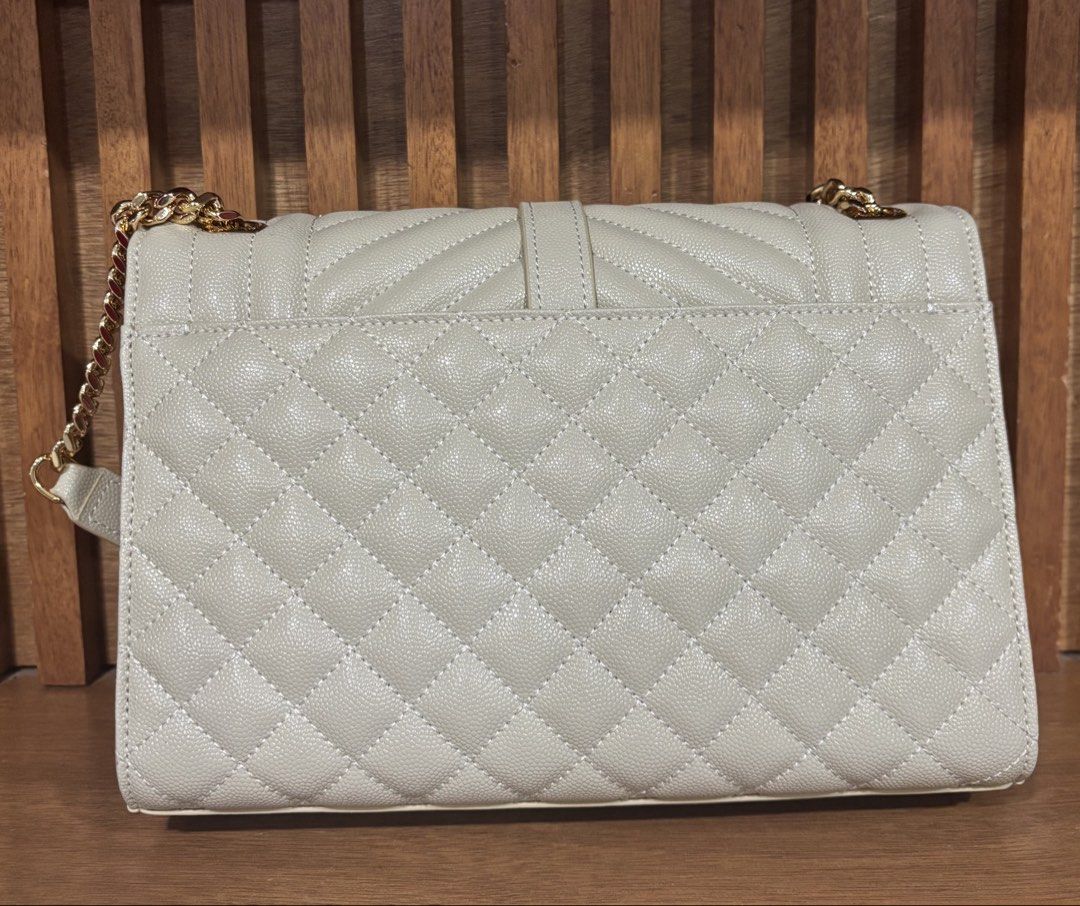 YSL Envelope (Category: Luxury Bags & Wallets) located in Muntinlupa City. Submitted by jdvcloset (Listing ID 1464031225, Image 2). Description: Off white Gold hardware not hollow Clean interior With dustbag.