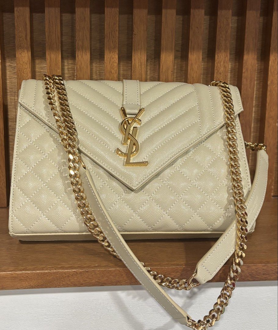 YSL Envelope (Category: Luxury Bags & Wallets) located in Muntinlupa City. Submitted by jdvcloset (Listing ID 1464031225, Image 1). Description: Off white Gold hardware not hollow Clean interior With dustbag.