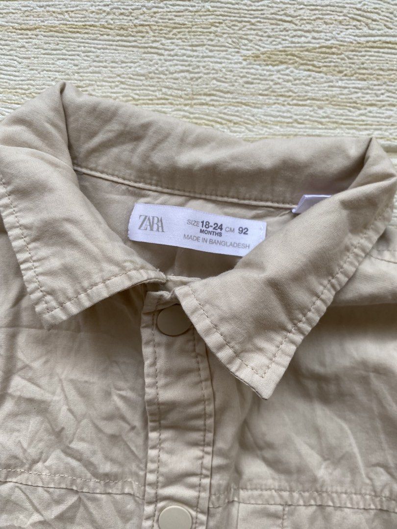 Zara cream cargo-style overshirt (Category: Babies & Kids Fashion) located in Cebu City. Submitted by yjainani (Listing ID 1463966327, Image 2). Description: light beige Zara cotton overshirt featuring a "Sunset Waves" graphic with fish printed on the back.
