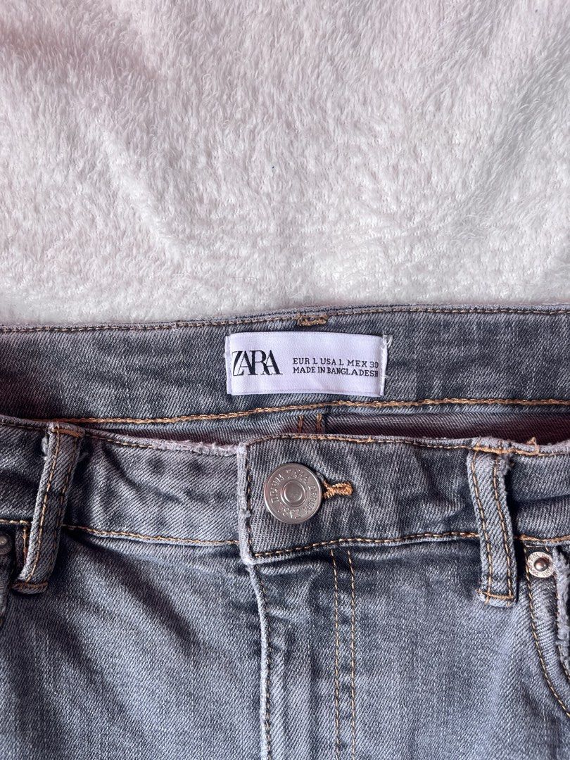 Zara Grey Denim Mini Skirt Size L (Category: Skirts) located in Cabuyao City. Submitted by jei_gspr (Listing ID 1463954737, Image 2). Description: - Zara grey denim mini skirt - Classic five-pocket style - Button and zip closure - Raw hem detail - Versatile: pairs well with t-shirts or blouses.
