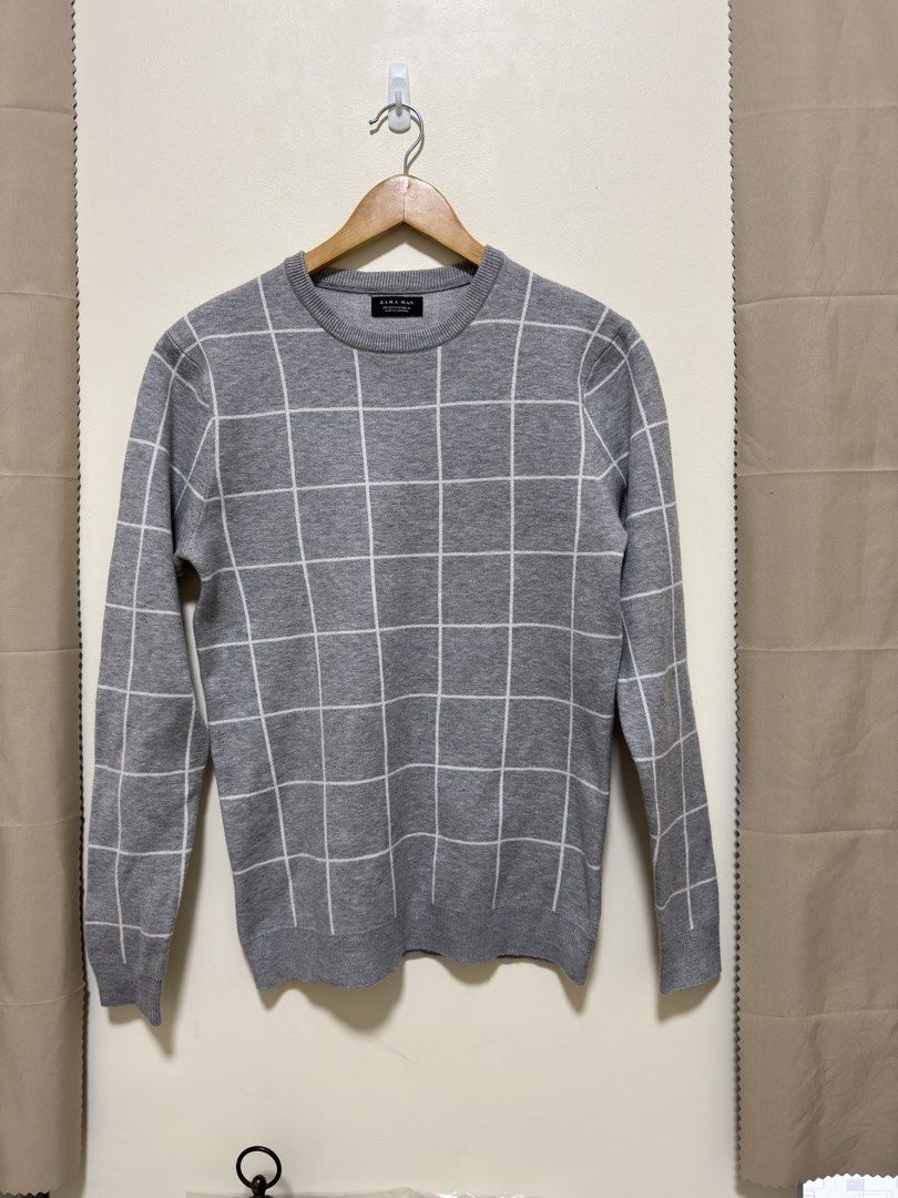 Zara Man Sweatshirt (Category: Coats, Jackets and Outerwear) located in Manila. Submitted by seayouncey (Listing ID 1463990102, Image 1). Description: - Zara Man Grey Sweater - All-over white grid pattern - Long sleeves - Comfortable knit fabric Size Length: 27 inches Shoulder: 16 inches Chest: 37 inches .
