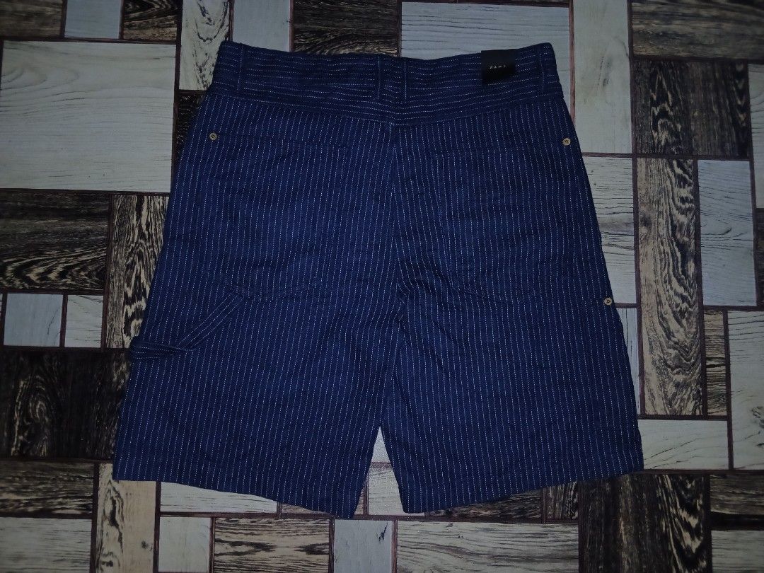 Zara Men's Striped Shorts Size 36 (Category: Shorts) located in Caloocan City. Submitted by youngmoon_51e2c6 (Listing ID 1464040795, Image 3). Description: - Zara shorts - Dark blue with white pinstripes - Button and zip front closure - Functional front pockets - Made in Turkey - Ideal for casual outfits.