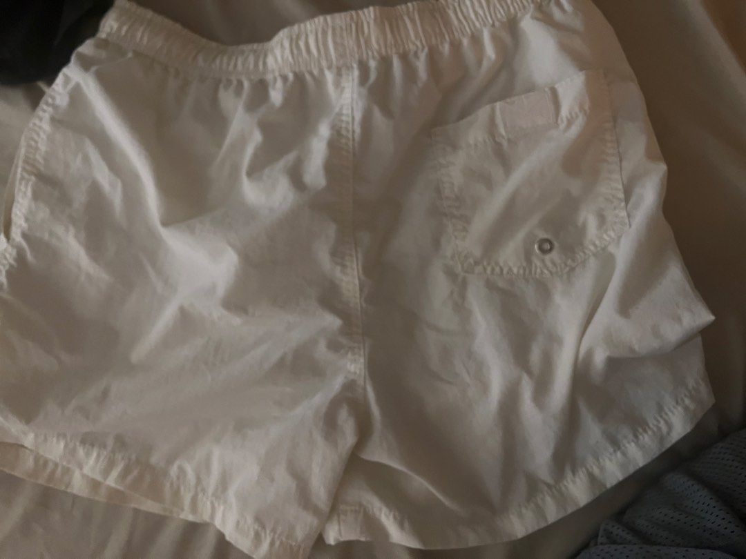 Zara White Swim Shorts Size L (Category: Shorts) located in Manila. Submitted by sethsethsethseth (Listing ID 1463983324, Image 3). Description: - White Zara shorts - Elastic waistband with drawstring - Inner mesh lining - Back pocket with button closure - Ideal for beach or pool days - Made in Bangladesh.