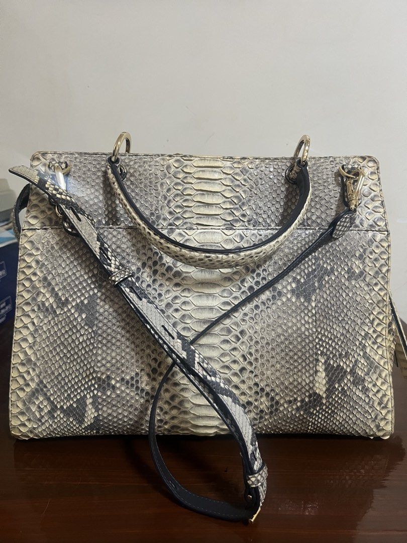 ZARMOI Genuine Python Snakeskin Handbag with Tassel Detail (Category: Luxury Bags & Wallets) located in Dipolog. Submitted by theagahisan (Listing ID 1463992641, Image 3). Description: - Genuine python snakeskin handbag - Unique scale pattern all over - Detachable shoulder strap included - Cute tassel charm - Elegant gold hardware details - Convenient top handle for carrying - Perfect statement piece for any outfit - Approximate dimensions: 12 in