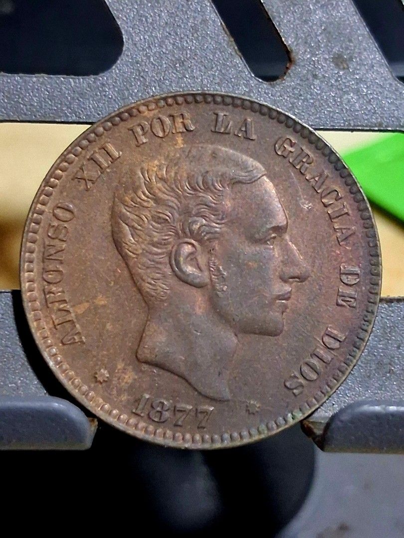 1877 Alfonso Xii 10c Om With die crack error (Category: Currency) located in Quezon City. Submitted by lobaman (Listing ID 1464266642, Image 2). Description: 1877 alfonso xii 10c om. with brillo. diecrack error. very scarce in this condition. no auction record yet in any major house..