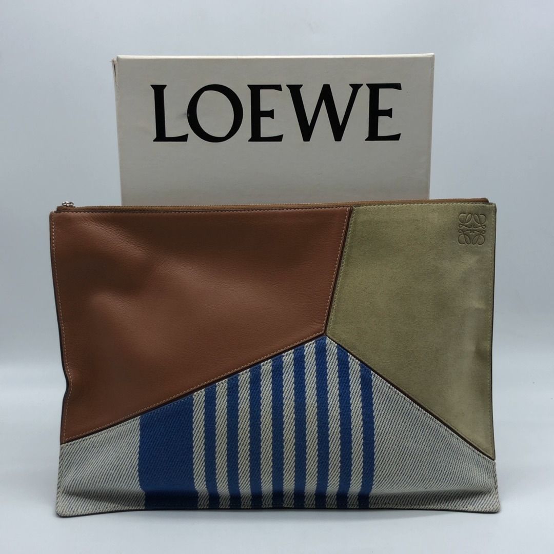 267008626 LOEWE BAG PUZZEL POUCH (Category: Luxury Bags & Wallets) located in Taguig. Submitted by ecoring.ph (Listing ID 1460215520, Image 2). Description: ◆CONDITION: B ◆DESCRIPTIONS: (Other defects/info:) OUTER: The body of the pouch has scratches, scuffs, stains, dirt, wrinkles, and press marks, with slight deformation, and shows signs of use. The edges and rubber lining of the pouch have scratches, scuffs, stains, dirt, press marks, and chip