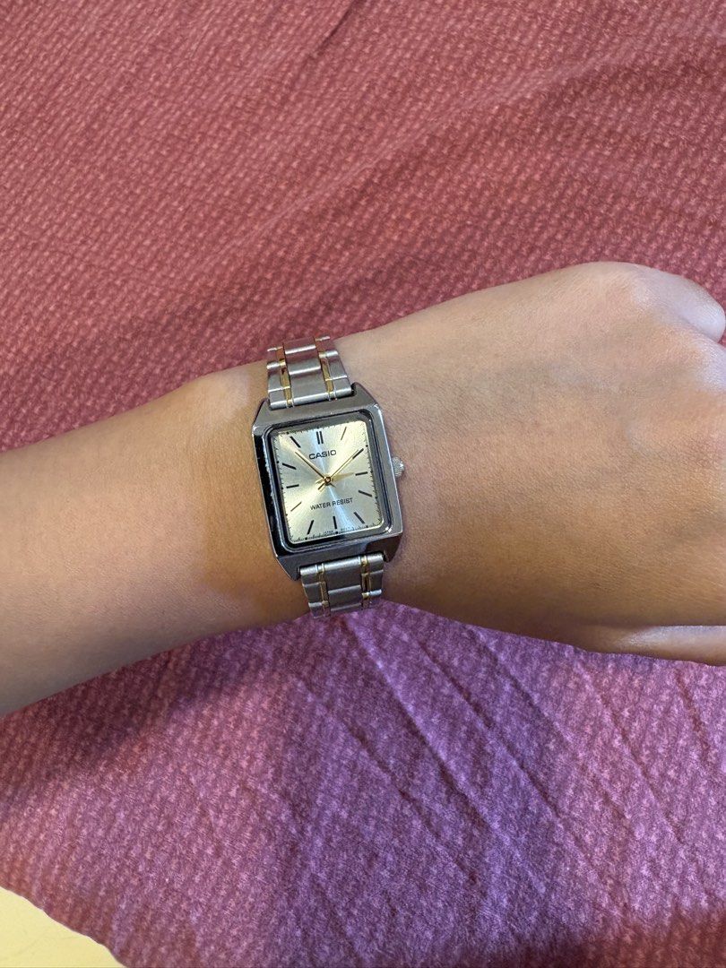 3 Casio Square Face Watches - Silver, Gold, Black (Category: Women's Watches) located in Quezon City. Submitted by mh0301 (Listing ID 1464200004, Image 3). Description: - Three Casio square face watches for sale. - Option 1: Silver metal band, white face with Roman numerals. - Option 2: Two-tone silver and gold metal band, champagne face. - Option 3: Black leather band, black face with Roman numerals. - All watches are water-resistant. - Versatil