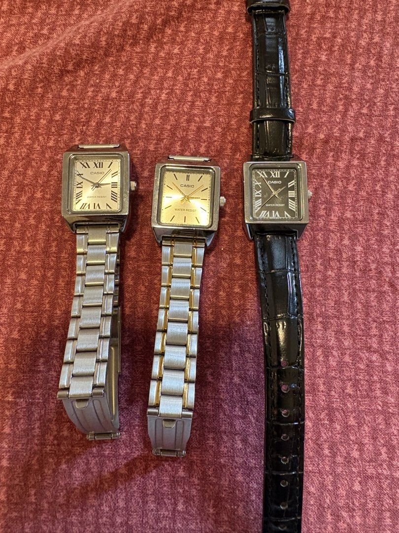 3 Casio Square Face Watches - Silver, Gold, Black (Category: Women's Watches) located in Quezon City. Submitted by mh0301 (Listing ID 1464200004, Image 1). Description: - Three Casio square face watches for sale. - Option 1: Silver metal band, white face with Roman numerals. - Option 2: Two-tone silver and gold metal band, champagne face. - Option 3: Black leather band, black face with Roman numerals. - All watches are water-resistant. - Versatil