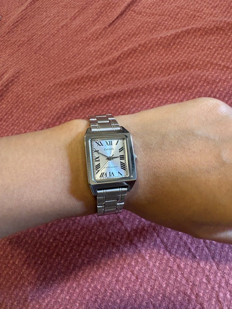 3 Casio Square Face Watches - Silver, Gold, Black (Category: Women's Watches) located in Quezon City. Submitted by mh0301 (Listing ID 1464200004, Image 2). Description: - Three Casio square face watches for sale. - Option 1: Silver metal band, white face with Roman numerals. - Option 2: Two-tone silver and gold metal band, champagne face. - Option 3: Black leather band, black face with Roman numerals. - All watches are water-resistant. - Versatil