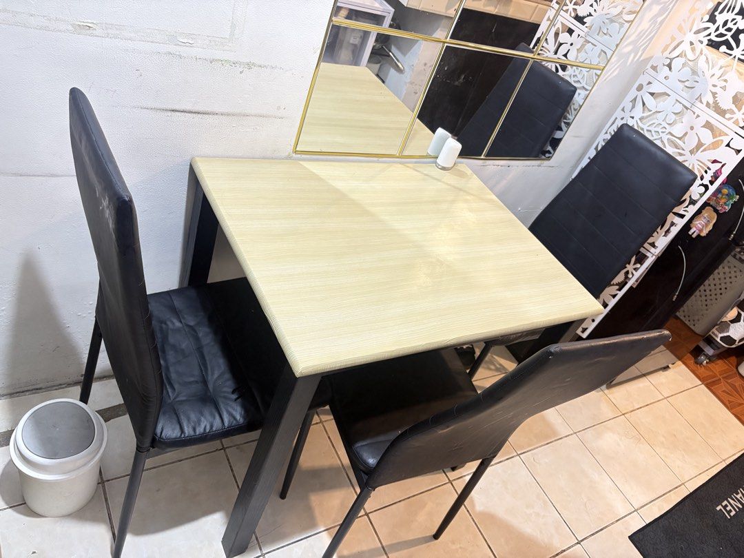 3-Seater Dining Table and Chairs Set (Category: Tables & Sets) located in Pasay City. Submitted by khawimaria (Listing ID 1464178475, Image 1). Description: - Compact dining set for three people. - Light wood tabletop with sturdy black metal legs. - Includes two comfortable black faux leather chairs. - Ideal for small apartments, dorms, or breakfast nooks. - Easy to clean surface for hassle-free maintenance. - Sold as a complete set..