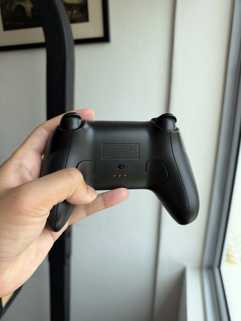 8BitDo ultimate bluetooth controller (Category: Controllers) located in Singapore. Submitted by walkinonsight (Listing ID 1464188236, Image 3). Description: Bluetooth 5.0 and 2.4g connectivity Slightly worn down left joystick Comes with box and wire.