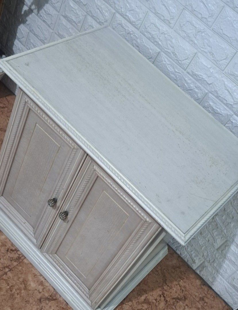 🤍 Vintage-Look Side Table Cabinet (Category: Office Furniture & Fixtures) located in Taguig. Submitted by authprelovedonlineshop1 (Listing ID 1464180799, Image 2). Description: ### 🤍 Vintage-Look Side Table Cabinet **Charming, elegant, and functional! ✨** - Beautiful **vintage-look design** - Features **2 cabinet doors** - Decorative handles for an elegant touch - Includes an **interior shelf** for added storage - Soft/light-colored finish - Pe