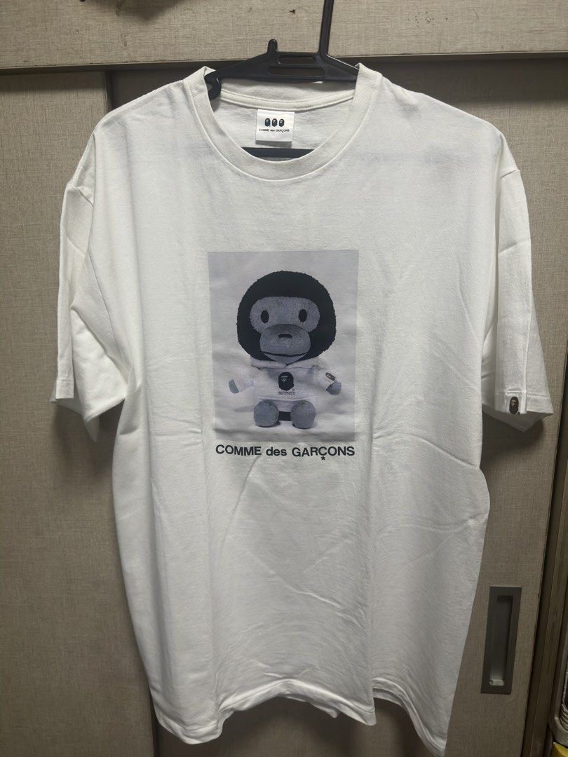 A Bathing Ape x Comme des Garcons Shirt (Category: Tshirts & Polo Shirts ) located in Quezon City. Submitted by jstn027 (Listing ID 1464192387, Image 1). Description: For Sale Bape x Comme des Garcons tee Size 2XL approx 24x30 Used (see photos for condition) rare size and collab 4500 nego pick up or shipping only Mindanao ave QC loc.