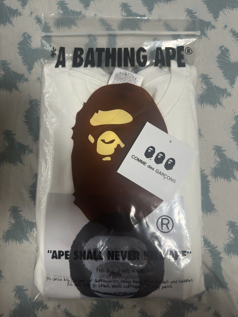 A Bathing Ape x Comme des Garcons Shirt (Category: Tshirts & Polo Shirts ) located in Quezon City. Submitted by jstn027 (Listing ID 1464192387, Image 2). Description: For Sale Bape x Comme des Garcons tee Size 2XL approx 24x30 Used (see photos for condition) rare size and collab 4500 nego pick up or shipping only Mindanao ave QC loc.