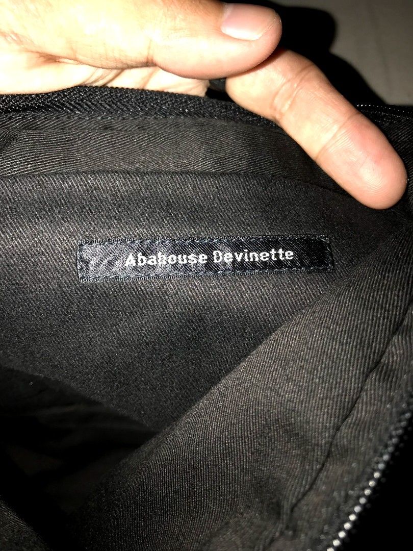 Abahouse Devlinette Black Textured Shoulder Bag (Category: Shoulder Bags) located in Iloilo. Submitted by junpopakoto (Listing ID 1464194028, Image 3). Description: - Archival/Y2k Bag - Brand: Abahouse Devinette - Color: Black - Style: Shoulder Bag - Exterior: Textured with a unique strap design - Closure: Zipper - Interior: 1 zippered pocket, 1 slip pocket - Ideal for: Everyday use - Approximate Dimensions: 12" W x 10" H.