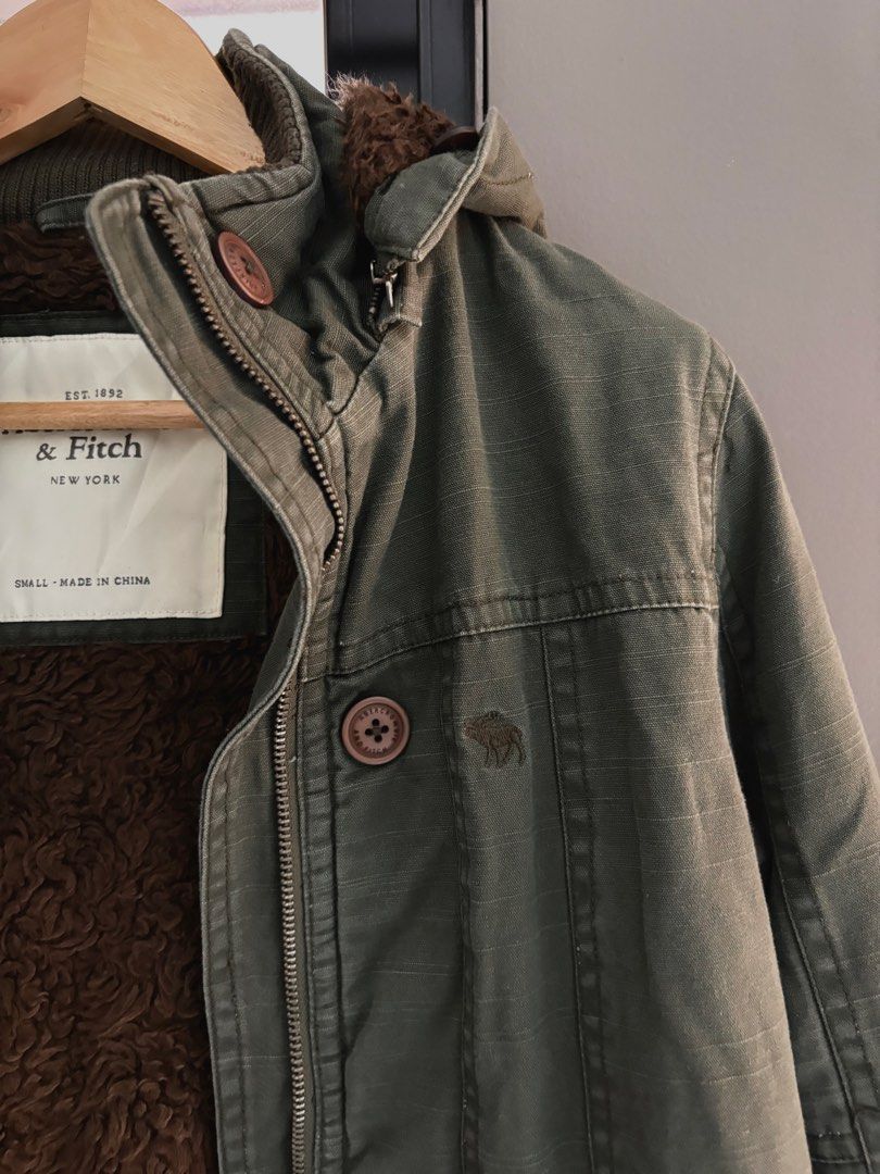 Abercrombie & Fitch Sherpa Lined Parka Jacket (Category: Coats, Jackets and Outerwear) located in Makati City. Submitted by allaineallaine (Listing ID 1464177828, Image 2). Description: - Olive green Abercrombie & Fitch parka - Sherpa-lined hood for extra warmth - Adjustable drawstring waist - Multiple front pockets - Size: Small - all zippers are working - no missing buttons - detachable hoodie - Ideal for colder weather -perfect pang Winter mo!