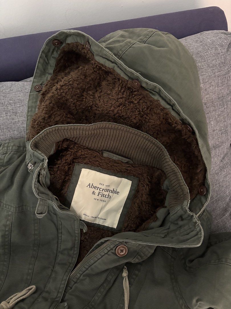 Abercrombie & Fitch Sherpa Lined Parka Jacket (Category: Coats, Jackets and Outerwear) located in Makati City. Submitted by allaineallaine (Listing ID 1464177828, Image 3). Description: - Olive green Abercrombie & Fitch parka - Sherpa-lined hood for extra warmth - Adjustable drawstring waist - Multiple front pockets - Size: Small - all zippers are working - no missing buttons - detachable hoodie - Ideal for colder weather -perfect pang Winter mo!